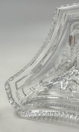 Lot 3 - Tiffany & Co., a group of four polished glass 'dolphin' candlesticks