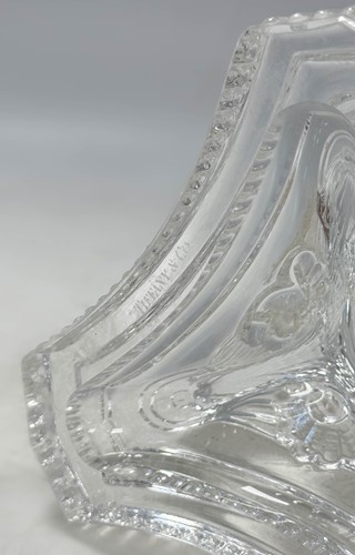 Lot 3 - Tiffany & Co., a group of four polished glass 'dolphin' candlesticks
