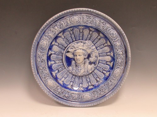 Lot 82 - A German stoneware tin glazed dish, decorated...