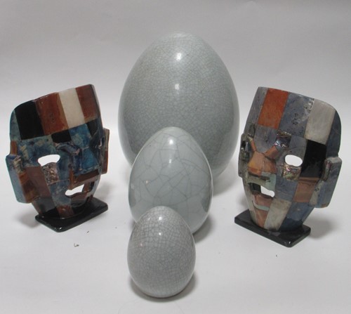 Lot 214 - A graduated set of six egg shaped ornaments,...