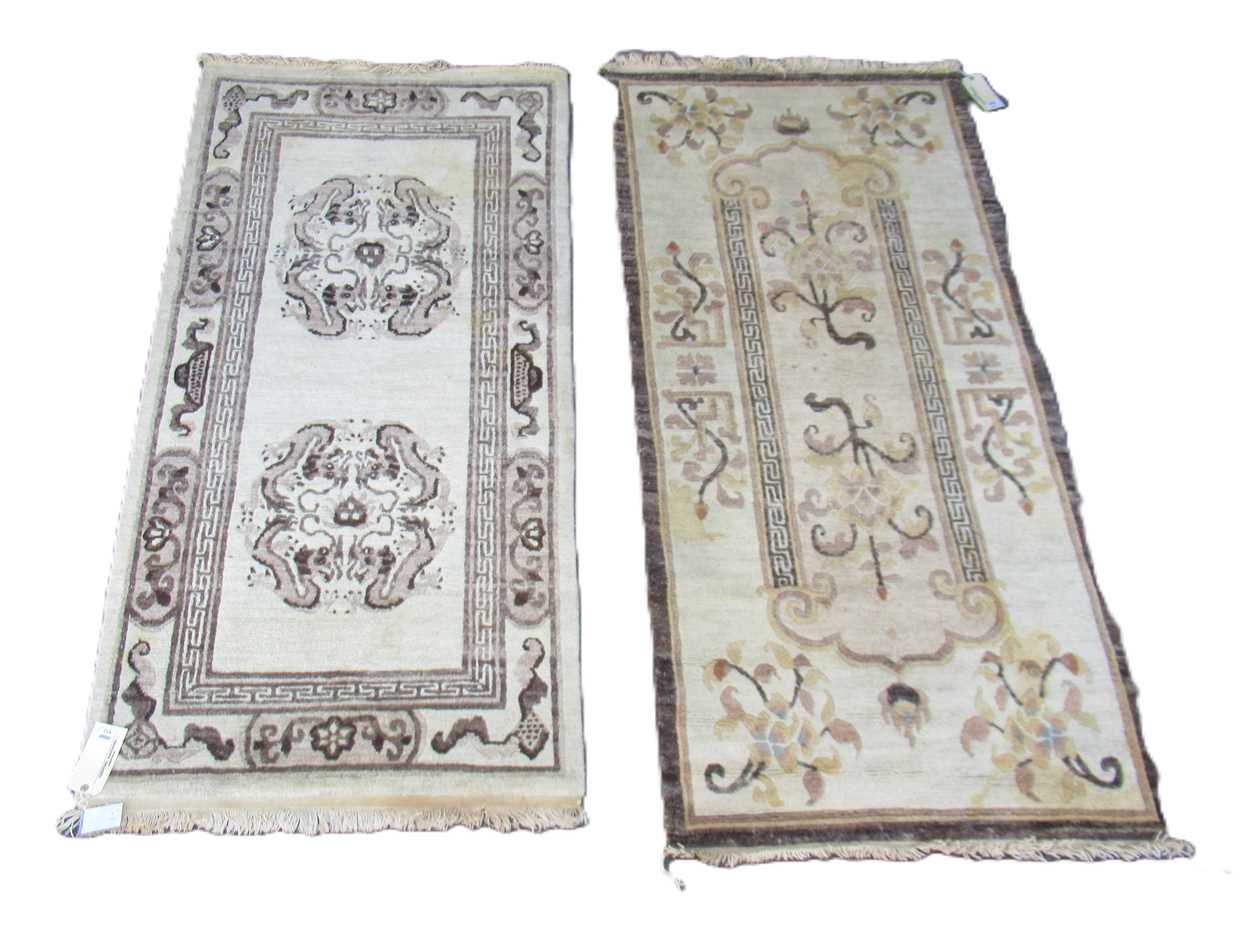 Lot 812 - Two similar hand-knotted Tibetan rugs, 192 x...