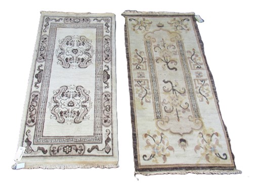 Lot 812 - Two similar hand-knotted Tibetan rugs, 192 x...