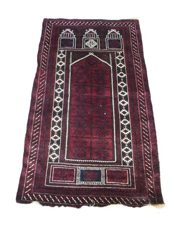 Lot 814 - A Beluchi prayer rug, 155 x 83cm