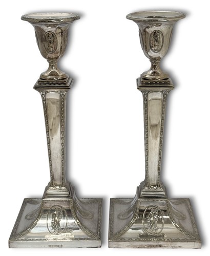 Lot 378 - A pair of Victorian silver plated candlesticks