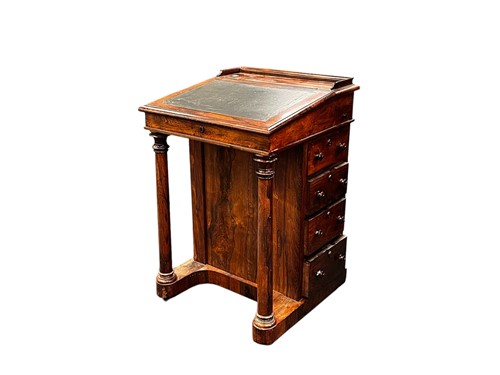 Lot 718 - An early 19th century rosewood Davenport, the...