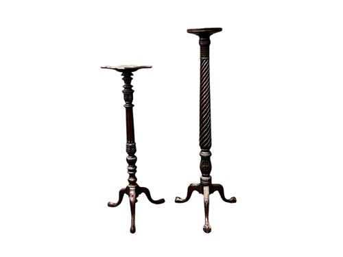 Lot 734 - Two 19th century mahogany torcheres with leaf...
