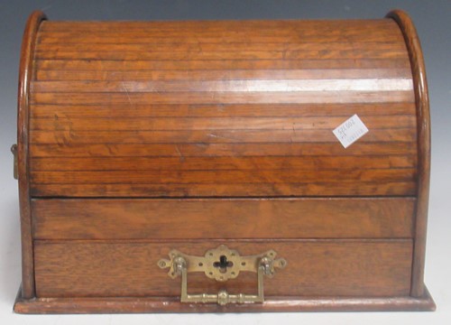 Lot 58 - An Edwardian oak tambour topped desk...