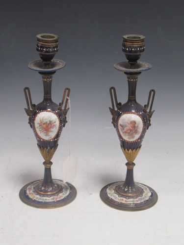Lot 41 - A pair of 19th century French jewelled blue enamel two handled candlesticks