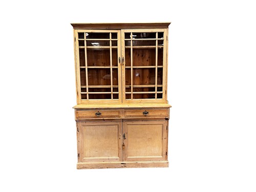 Lot 648 - A 20th century pine glazed top cabinet, with a...