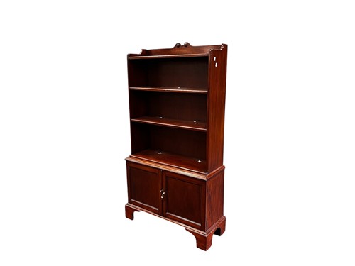 Lot 671 - A reproduction mahogany bookcase, with four...