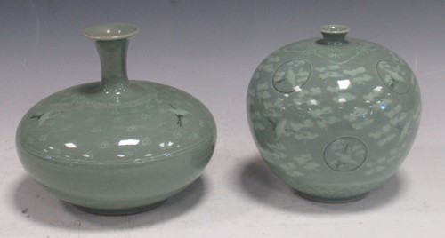 Lot 174 - Two Japanese green glazed vases decorated with...