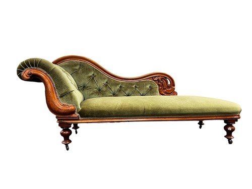 Lot 651 - A Victorian walnut chaise longue, with carved...