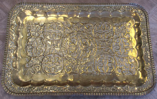 Lot 61 - A large Middle Eastern brass tray, 100 x 66cm