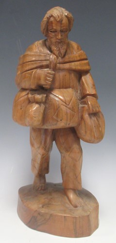 Lot 29 - A carved chestnut or walnut standing figure of...