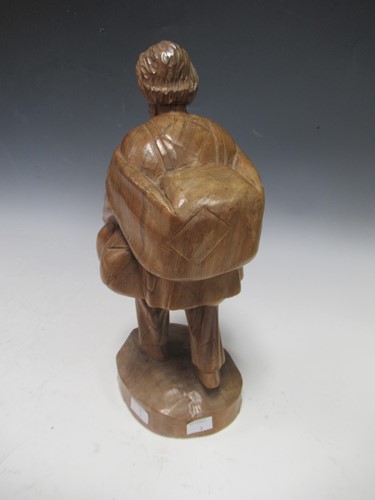 Lot 29 - A carved chestnut or walnut standing figure of...