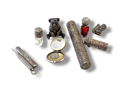 Lot 345 - A collection of silver objets including scent...