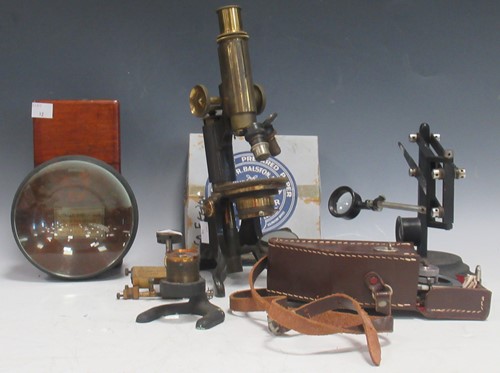Lot 56 - A lacquered brass microscope by Baker,...