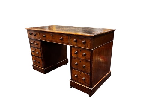 Lot 750 - An Edwardian mahogany leather topped pedestal...