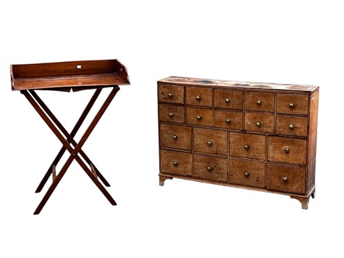 Lot 639 - A 20th century pine bank of 18 small drawers,...