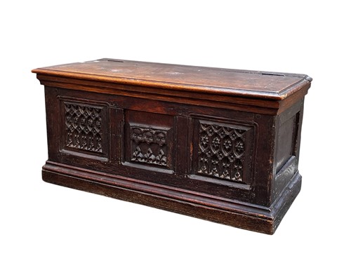 Lot 623 - An triple panelled oak chest, incorporating...