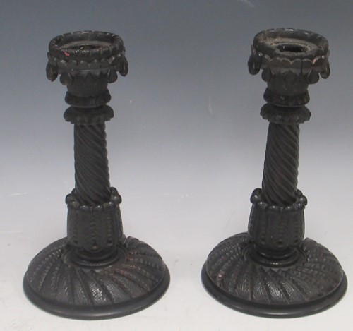 Lot 31 - A pair of Anglo-Indian turned ebony candlesticks