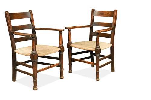 Lot 178 - A pair of over-sized Arts & Crafts ash elbow chairs