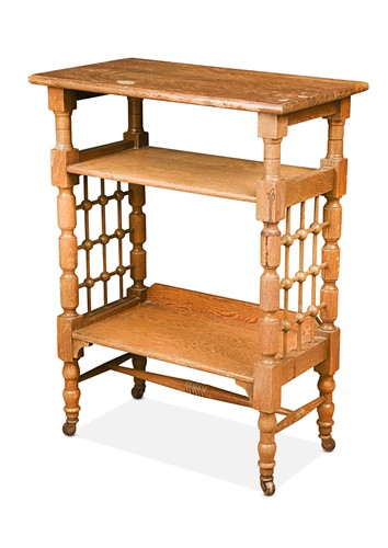 Lot 187 - Leonard Wyburd for Liberty & Co., an Arts & Crafts oak three-tier book or side table, circa 1900