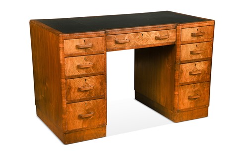Lot 223 - An Art Deco figured walnut pedestal desk
