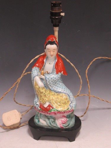 Lot 181 - A Chinese Buddhist porcelain figure, possibly...