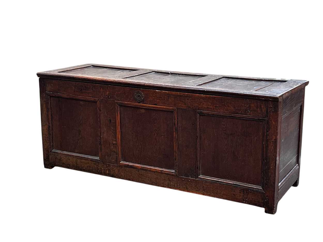 Lot 629 - An 18th century oak coffer, with triple...