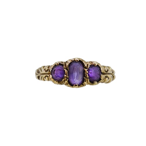 Lot 7 - A 9ct gold amethyst three stone ring