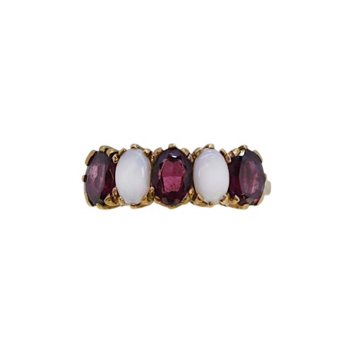 Lot 18 - A 9ct gold garnet and opal ring