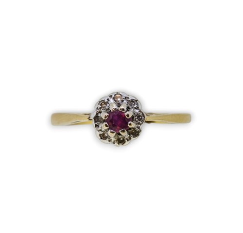Lot 31 - A ruby and diamond cluster ring