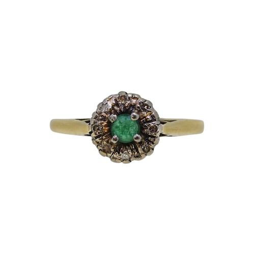 Lot 42 - An emerald and diamond cluster ring