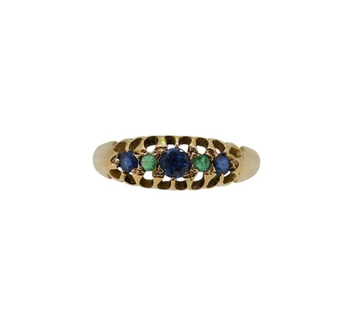 Lot 38 - An 18ct gold sapphire and emerald ring