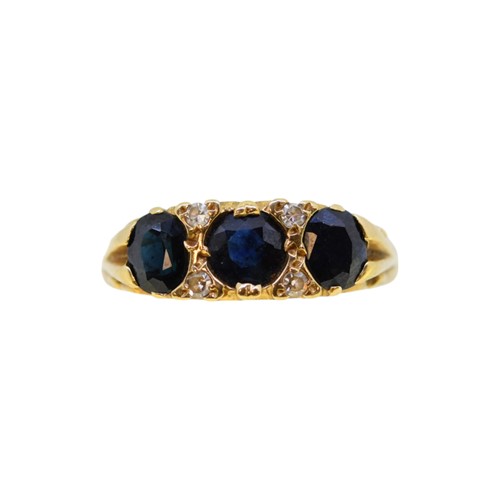 Lot 108 - An 18ct gold sapphire and diamond ring