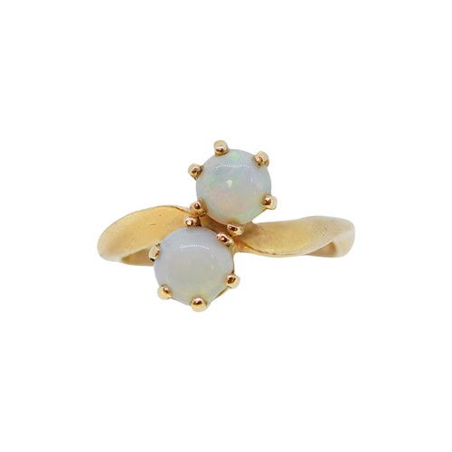 Lot 15 - A two stone opal crossover ring