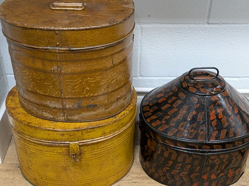 Lot 253 - Three metal (2 x tin and 1 x black and red...