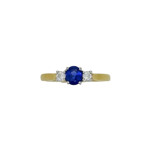 Lot 99 - An 18ct gold sapphire and diamond three stone ring