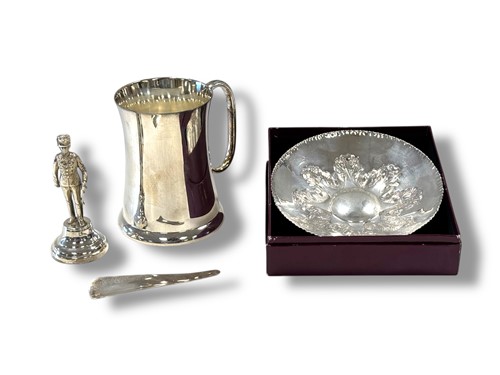 Lot 338 - A Garrard & Co silver model of a soldier and a...