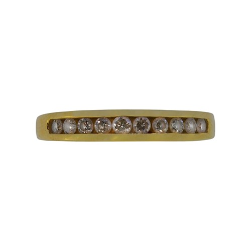 Lot 89 - An 18ct gold diamond set half hoop ring