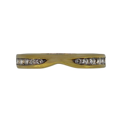 Lot 63 - An 18ct gold diamond set band