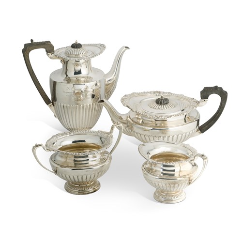 Lot 451 - A George V silver 3-piece tea set with one addition