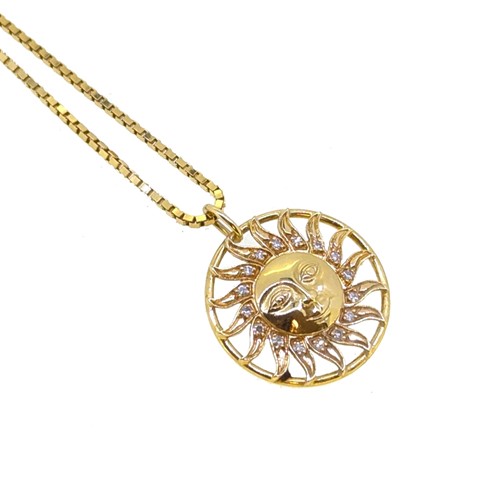 Lot 128 - A diamond set sun pendant and chain
