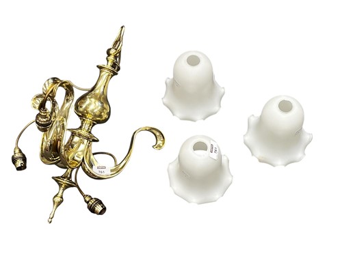 Lot 761 - A late Victorian or Edwardian brass three...
