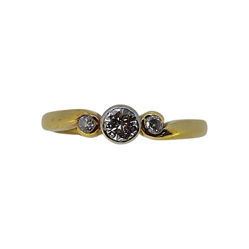 Lot 101 - An 18ct gold three stone diamond ring