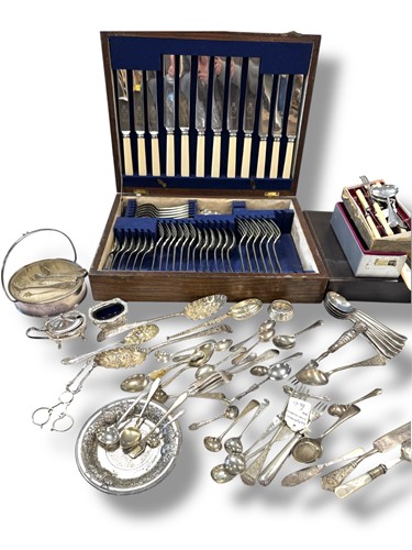Lot 334 - a collection of silverware including a butter...