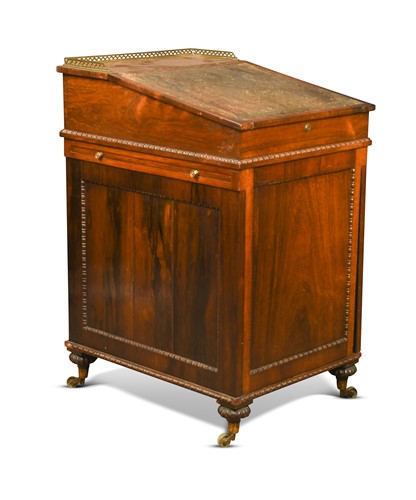 Lot 379 - A rosewood slide top Davenport, early 19th century