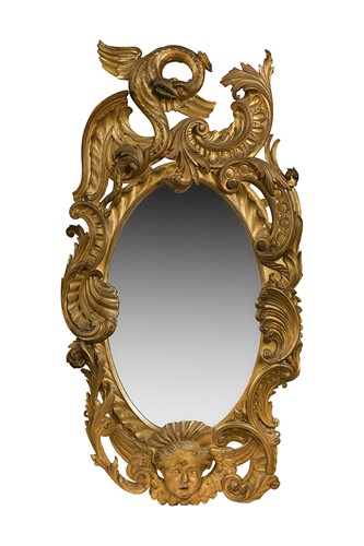 Lot 301 - A Rococo style carved giltwood wall mirror, 19th century