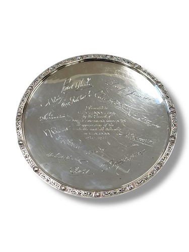 Lot 337 - A silver circular dish with decorative rim and...